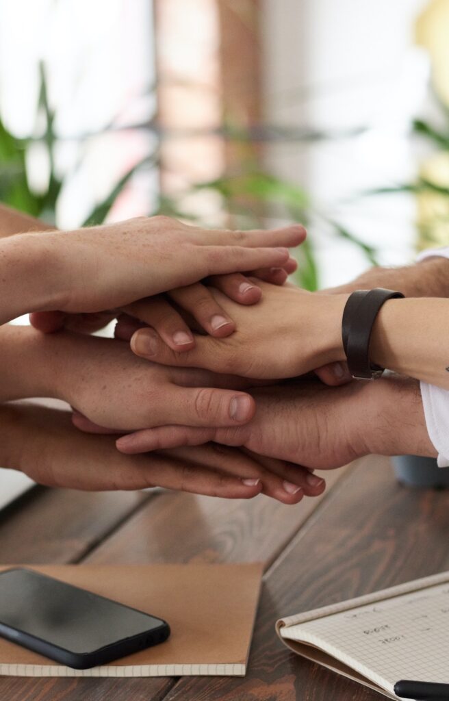 Hands stacking on top of each other